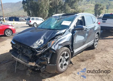 2019 Honda Cr-V Touring z USA, uszkodzony, nr VIN 7FARW2H90KE031598